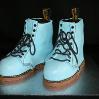 Doc Martin Shoes Doc Martin Shoes. Made from chocolate mud cake. 2T at the back. Fondant covered, Shimmer and extrude shoe laces. They are probably a size 9...