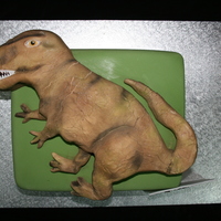 T-Rex Customer bought me in a picture to copy of this T-Rex for his girlfriend who is dino crazy. The cake underneath is Choc mud and the dino on...