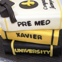 Stacked Graduation Book Cake 3 Stacked books with Black and Yellow theme for Xavier University and stethoscope to represent her Pre-Med major.