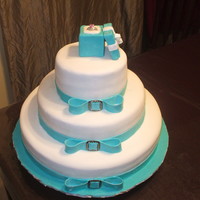 Breakfast At Tiffany's Wedding Cake 14" is Bailey's & Coffee cake with Bailey's butercream filling, 10" is Cosmopolitan cake with cranberry buttercream...