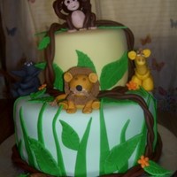 Baby Shower Jungle Baby shower jungle themed cake. Two layer chocolate cake with butter cream icing covered with marshmellow fontant. My first attempt ever to...