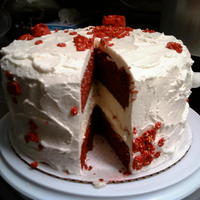 Red Velvet And Cheesecake this is a 3 layer 9" cake I made for the first time. Took me forever!!!!The middle layer is chessecake topped with chocolate ganache...