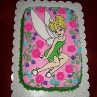Tinkerbell Iced with buttercream decorated with royal icing flowers, & color flowed Tinkerbell!!!