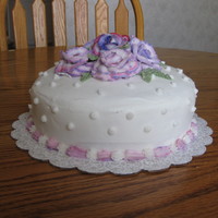 Coming Up Roses I made this cake for my Mom's Birthday. It's a 4 layer vanilla cake with buttercream icing and decorations.