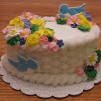 Spring Time Basket This is the Grand Finale cake from Course 2. The flowers are made of royal icing and the rest is buttercream. The basketweave is my...