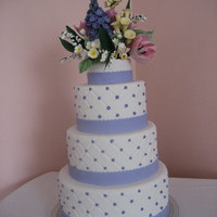 Spring Wedding Fondant covered cake with hand made gum paste spring flowers.