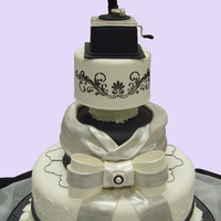 Black And White Wedding Cake Gramaphone made in gumpaste. Sugar rocks are from Crystal Candy found at Kings supermarket. They are wonderful to use and dont loose their...
