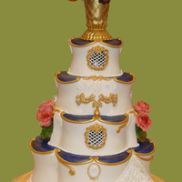 Elegant Wedding Cake With Blue And Gold Accents All in fondant and gumpaste peonies and flowers