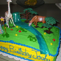 Jungle Themed Birthday Party chocolate/ vanilla cake with custard and strawberry filling. covered in .butter cream frosting