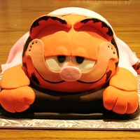 Garfield My 5 yr old daughter, asked me to make a Garfield cake for her birthday this year, but requested that he have a pink blanket, because this...