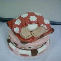 Ashley's Baby Shower Cake Bottom layer is red velvet with cheesecake mousse filling, middle layer is french vanilla vake with white choclate mousse filling, top is...