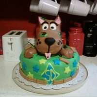 Scooby Doo Busting Out Cake was milk chocolate with orea cream filing. All covering and accents are MMF. Scooby himself is RKT with MMF covering. The cookies are...