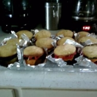 Cheeseburger Cupcakes These were made to go with my nephew's scooby doo cake. I figured Scooby was always eating sandwiches ...why not some burgers. HAHA....