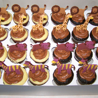 Jungle Babyshower Cupcakes These were made for a large baby shower of around 50 people. They were made to match the nursery theme. The jungle animals were all drawn...