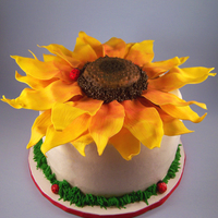 Sunflower With Ladybugs This was made as a birthday cake. It was my first time using gumpaste and i will have to say i learned a lot The petals and ladybugs are...