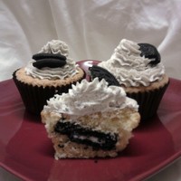 Oreo Overload!! Moist Vanilla pod cupcakes with a whole oreo cookie baked into the center! topped with creamy buttercream with heaps of crushed oreos mixed...