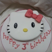 Hello Kitty hello kitty face cake, carved from a 10" round vanilla cake. covered with fondant,fondant bow and lettering. eyes and whiskers are...