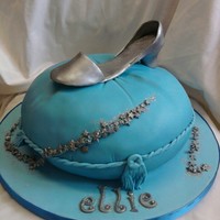 Glass Slipper 10" cake carved into a pillow shape with a fondant glass slipper on top. taken from a debbie brown book TFL