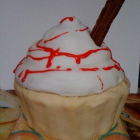 Ice Cream Cake Ice cream cake make with the nordicware giant cupcake pan. Covered in fondant with glace icing for the "sauce".