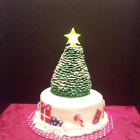 Christmas Tree Three layer white cake with peppermint buttercream filling. Tree is made from RKT and covered with individual heart shaped fondant pieces...