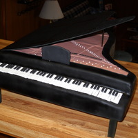 Grand Piano 4 - 11x15 and 2 - 9X13 Butter Yellow Cake - Cut and shaped on a shaped board. All of the cake is covered with fondant. The lid is actually...