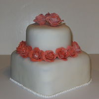 Mini Rose Cake 6" square tier on bottom and 4" tier on top. 18 roses made from gum paste, royal icing bead border.