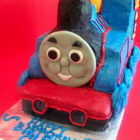 Good Ol' Thomas This was the first cake I ever iced completely. No fondant. Chocolate cake with a swiss meringue and strawberry puree buttercream filing....
