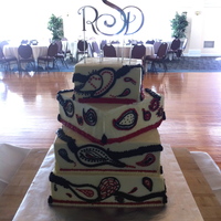 Paisley Wedding Cake This cake was a conglomeration of flavors, with the anniversary tier being red velvet and chocolate and filled with ganache. The other...