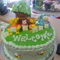 Winnie The Pooh Baby Shower Cake This is a cake that I did for a friend of mine's baby shower. I modeled the figures out of fondant. I did the tree out of royal icing...