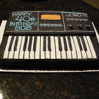 Keyboard Cake This is a full sheet cake with a half layer on top carved to resemble a electronic keyboard. The cake was a dark chocolate cake with...