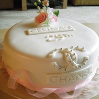 White Chanel MMF, 10 inch, gum paste roses. I was going for a simple, classy look. I think I half accomplished it. I just started baking about 2 months...