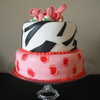 Birthday Cake Inspired by a cake I saw on CC. 2 tier, 8', and 6' layers with fondant. Gumpaste used for details. TFL