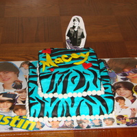 Justin Beiber Cake Made for a little gir's birthday. She loves Justin Beiber. It's buttercream icing with MMF decorations. The Justin topper is is...