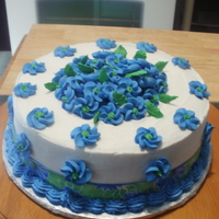Flower Cake This is a buttercream cake with royal icing swirl flowers all over.