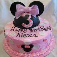Minnie Cake pink and white minnie mouse cake. Ears and dots are made of fondant.