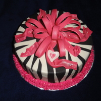 Happy Birthday Cassidy! 10" Smooth BC - white cake with seedless red raspberry, fondant bow, heart and stripes, edible pearls. Large white heart for Mom and...