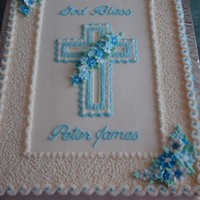 First Communion/baptism Cake Cake frosted and decorated in buttercream with royal icing flowers.
