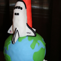 Nasa Space Shuttle Endeavor Made for a birthday cake for a Nasa fanatic! Chocolate cake with a layer of vanilla cake in the middle of the earth. Space shuttle and tank...