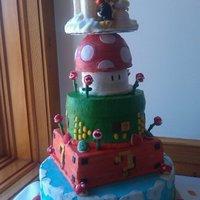 Nintendo Wedding Cake This was my first actual wedding cake made for a friend. Hand made the cake topper, everything is edible. The bride found a few different...