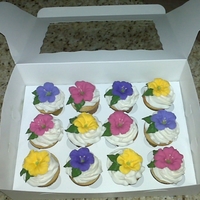 Petunia Cupcakes I make these for my business customers. They love it when I call on them for business. BC frosting with RI petunias.