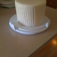 Simple Round Wedding Cake This cake was an absolute nightmare :P The bride wanted it 7" tall, and after researching I decided that i should put a support board...