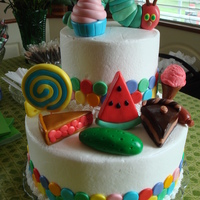 Very Hungry Caterpillar Two Tier Cake with fondant decorations.