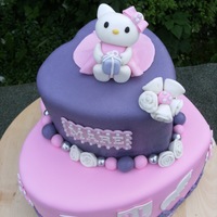 Hello Kitty my first hello kitty, covered with fondant. kitty was made with fondant, isn't she cute?