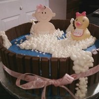 Bath Tub Baby Shower Cake 12" round cake covered in buttercream. Kit kats around the side...tied with a bow. The bubble are just buttercream frosting sprinkled...