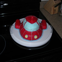 Little Einsteins Rocket Made for my son's 3rd birthday. My husband carved the cake and it has twinkies for the rockets. The top is a sucker.