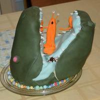 Alligator With Lobster In Jaws Help requested: Alligator, lobster cake falling apart. Fondant, tried to hold it together with chopsticks (seen emerging from gator's...