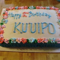 Luau Birthday Cake simple buttercream iced cake for a luau themed party. it's hard to see, but i did "grass skirt" on the sides