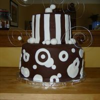 Made For A Client chocolate cake, with chocolate whipped ganache filling with toffee bits, covered in chocolate buttercream and chocolate fudge fondant.