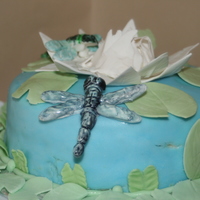 Water Lily Cake This is a cake I did for one of my Final Wilton Classes. Fondant and Gumpaste with gumpaste dragonflies and water lily.