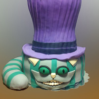 Wonderland Cake The hat is a dummy cake, the tail is RKT and the cake is chocolate cake dilled with chocolate ganache and strawberries.